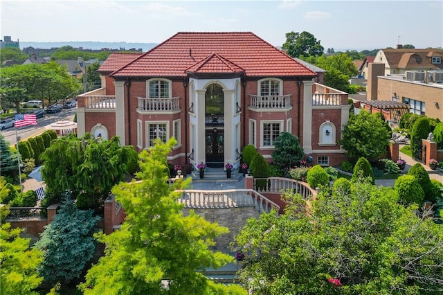 8524 Ridge Blvd, Brooklyn, NY 11209 - view of front facade featuring a tiled roof, a balcony, and french doors