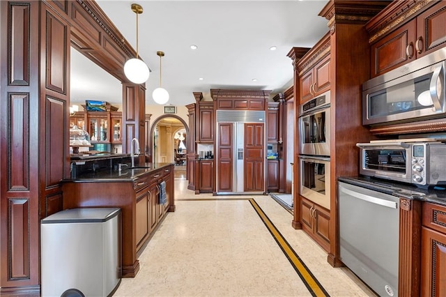 8524 Ridge Blvd, Brooklyn, NY 11209 - kitchen with appliances with stainless steel finishes, inlaid floor details, decorative light fixtures, recessed lighting, and arched walkways