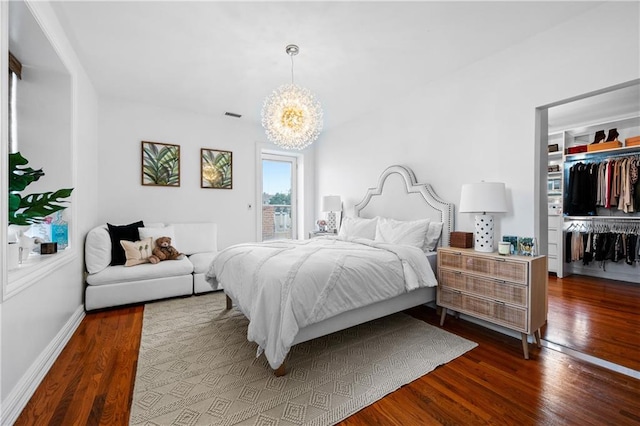 8524 Ridge Blvd, Brooklyn, NY 11209 - bedroom with dark wood finished floors, a chandelier, a spacious closet, and a closet