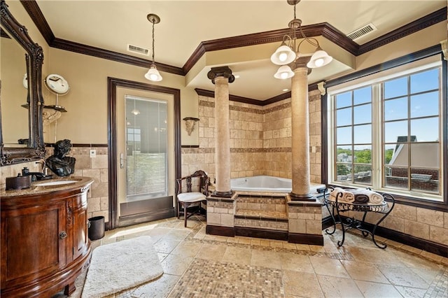 8524 Ridge Blvd, Brooklyn, NY 11209 - bathroom featuring ornate columns, tile walls, vanity, crown molding, and stone tile floors
