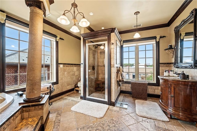 8524 Ridge Blvd, Brooklyn, NY 11209 - bathroom with tile walls, ornamental molding, a shower stall, vanity, and decorative columns