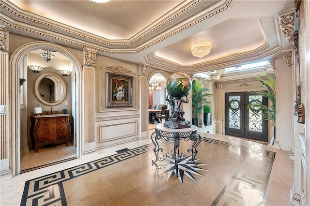 8524 Ridge Blvd, Brooklyn, NY 11209 - foyer featuring arched walkways, a raised ceiling, french doors, inlaid floor details, and ornamental molding