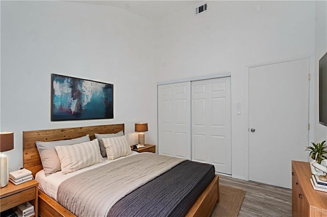 211 Dover Grn, Staten Island, NY 10312 - bedroom featuring a closet, wood finished floors, and lofted ceiling
