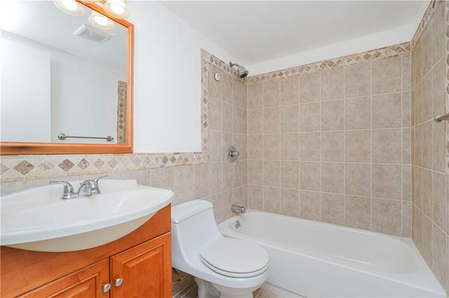 211 Dover Grn, Staten Island, NY 10312 - full bathroom featuring vanity, tub / shower combination, and tile walls