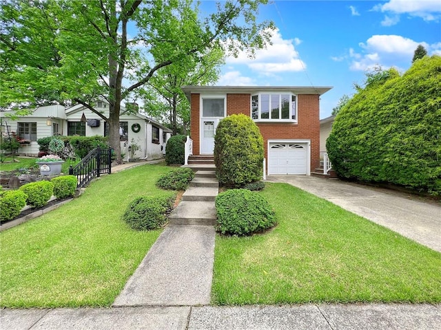 45 W Ter, Staten Island, NY 10312 - view of front of property featuring brick siding, driveway, a garage, and a front yard