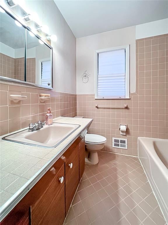 45 W Ter, Staten Island, NY 10312 - full bath featuring tile walls, vanity, tile patterned flooring, and a bath