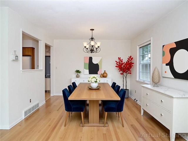 45 W Ter, Staten Island, NY 10312 - dining space featuring a chandelier and light wood finished floors