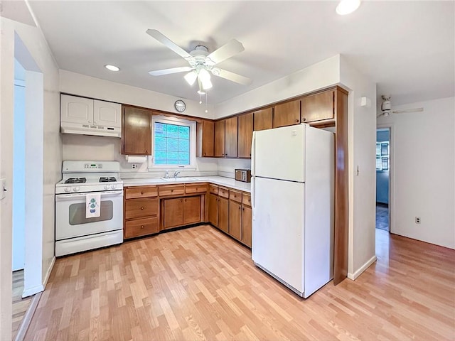 45 W Ter, Staten Island, NY 10312 - kitchen with white appliances, under cabinet range hood, a ceiling fan, light wood-type flooring, and light countertops