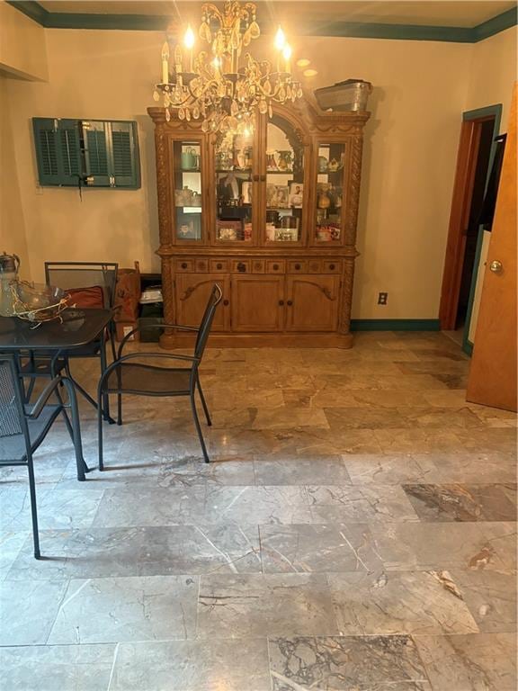 2339 80th St, Brooklyn, NY 11214 - dining area with a chandelier, ornamental molding, and light stone finish flooring