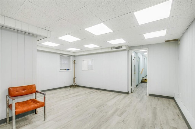 8301 4th Ave, Brooklyn, NY 11209 - spare room with light wood finished floors, a paneled ceiling, and stairway