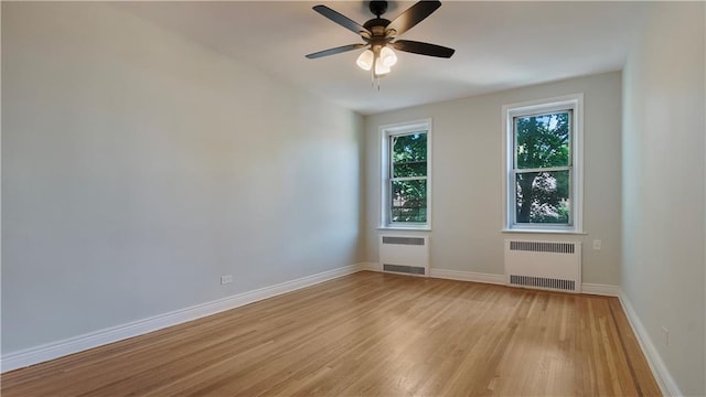 1560 E 18th St Unit 3D, Brooklyn, NY 11230 - spare room featuring radiator, light wood-style floors, and ceiling fan