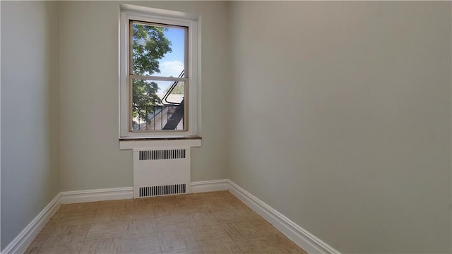 1560 E 18th St Unit 3D, Brooklyn, NY 11230 - empty room featuring radiator heating unit and baseboards