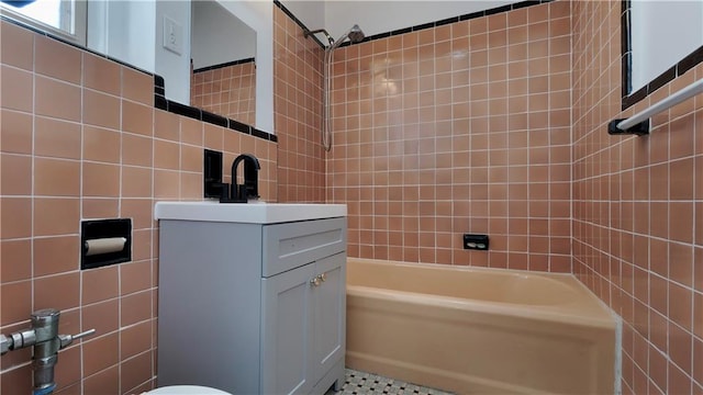 1560 E 18th St Unit 3D, Brooklyn, NY 11230 - full bathroom featuring tile walls, shower / washtub combination, and vanity