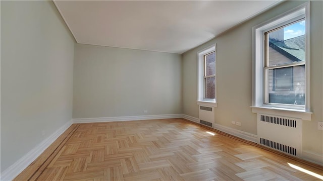 1560 E 18th St Unit 3D, Brooklyn, NY 11230 - spare room featuring radiator and healthy amount of natural light