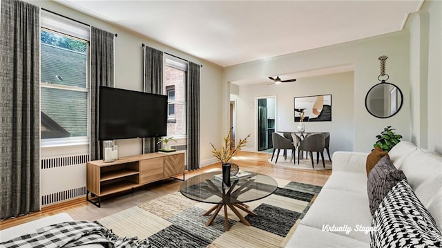 1560 E 18th St Unit 3D, Brooklyn, NY 11230 - living area with radiator and wood finished floors