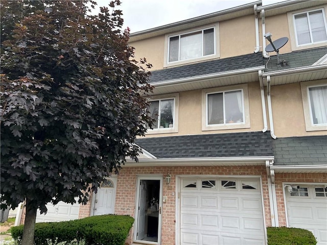 82 Seagate Ct, Staten Island, NY 10305 - multi unit property featuring stucco siding, a garage, a shingled roof, and brick siding