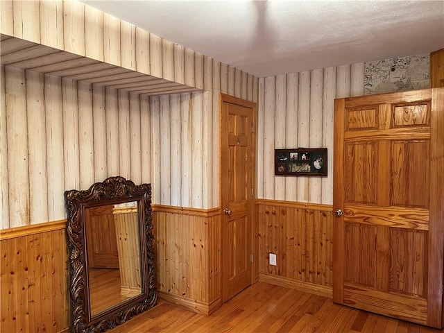 82 Seagate Ct, Staten Island, NY 10305 - hall featuring hardwood / wood-style flooring, wood walls, and a wainscoted wall