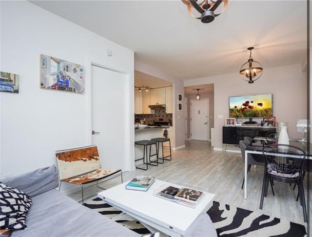 100 Oceana Dr W Unit 4J, Brooklyn, NY 11235 - living room with a chandelier and light wood-style flooring