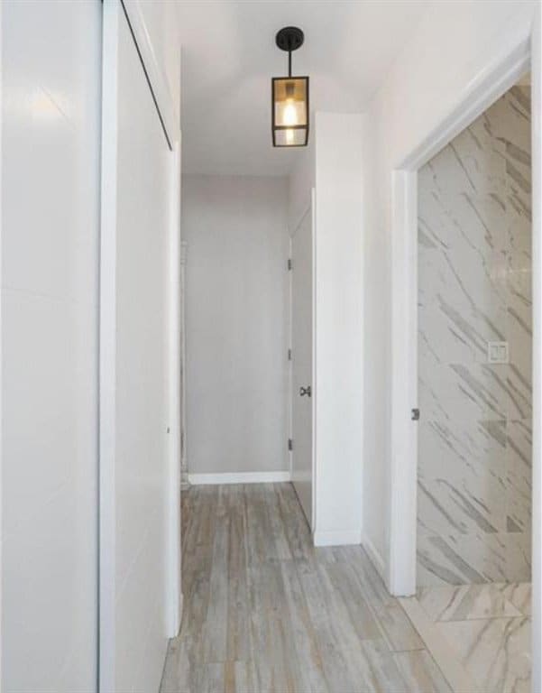100 Oceana Dr W Unit 4J, Brooklyn, NY 11235 - corridor featuring light wood finished floors and baseboards
