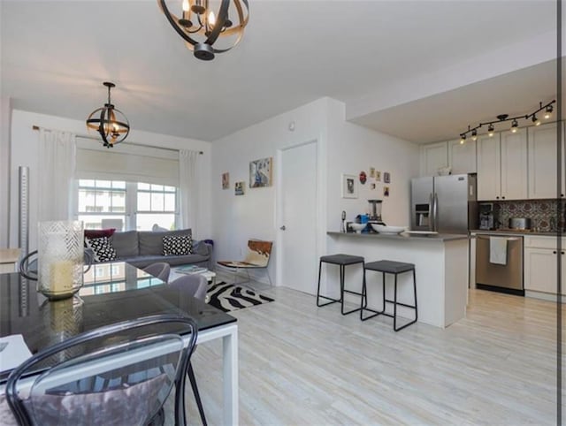 100 Oceana Dr W Unit 4J, Brooklyn, NY 11235 - living room featuring a chandelier and light wood-style floors