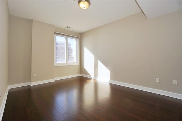 90 Bay Street Lndg Unit 4B, Staten Island, NY 10301 - spare room with dark wood-style floors and baseboards