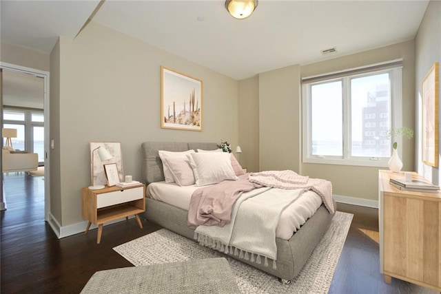 90 Bay Street Lndg Unit 4B, Staten Island, NY 10301 - bedroom with dark wood finished floors and baseboards