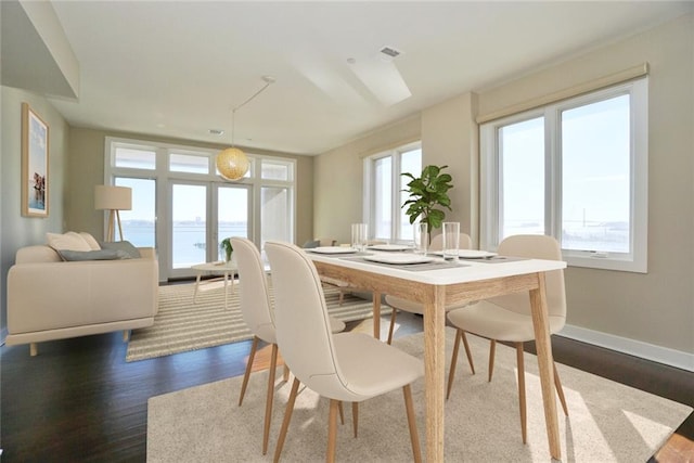 90 Bay Street Lndg Unit 4B, Staten Island, NY 10301 - dining space featuring dark wood finished floors and a water view