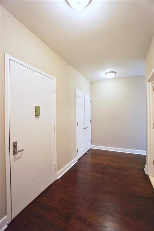 90 Bay Street Lndg Unit 4B, Staten Island, NY 10301 - hallway featuring dark wood-type flooring and baseboards