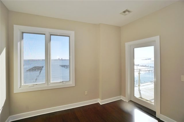 90 Bay Street Lndg Unit 4B, Staten Island, NY 10301 - spare room with dark wood-style flooring and baseboards