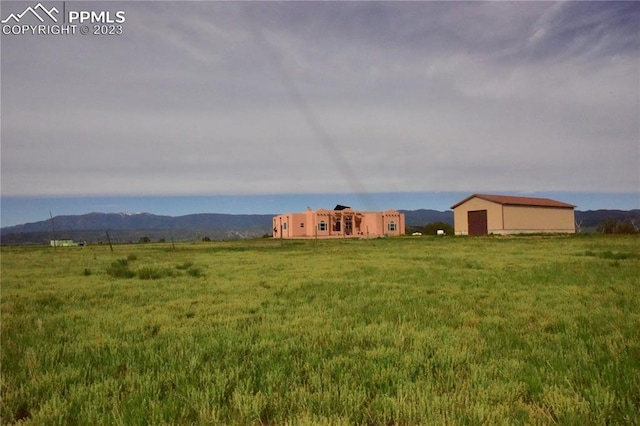 exterior space featuring a rural view and a mountain view