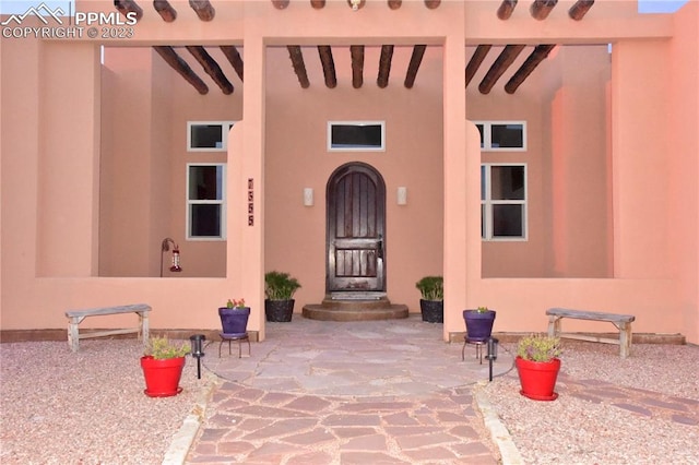 entrance to property with a patio area