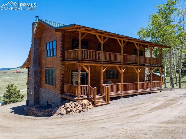 log-style house with a balcony