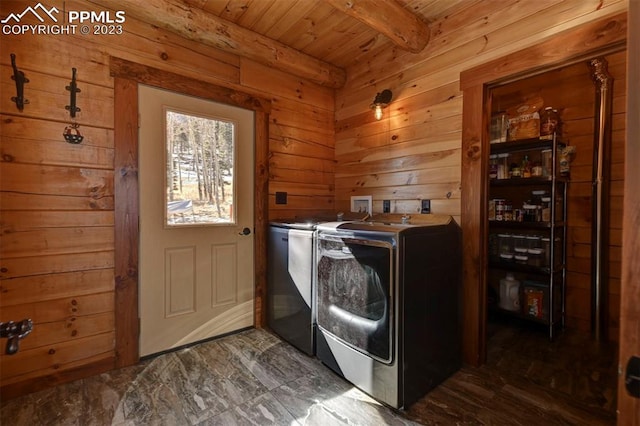 laundry room featuring washer and clothes dryer, dark hardwood / wood-style floors, washer hookup, and wooden ceiling