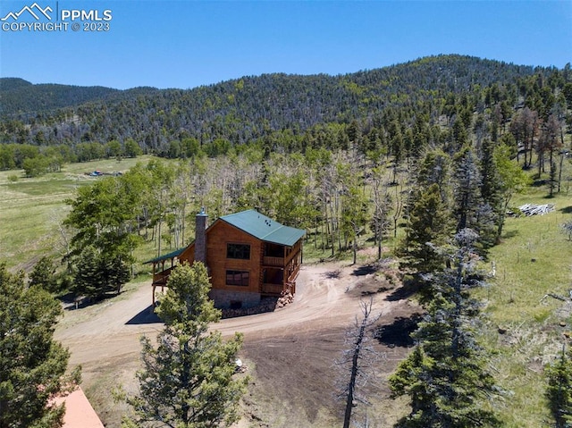 drone / aerial view with a mountain view and a rural view