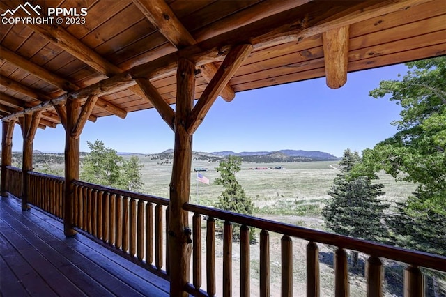 wooden deck featuring a mountain view