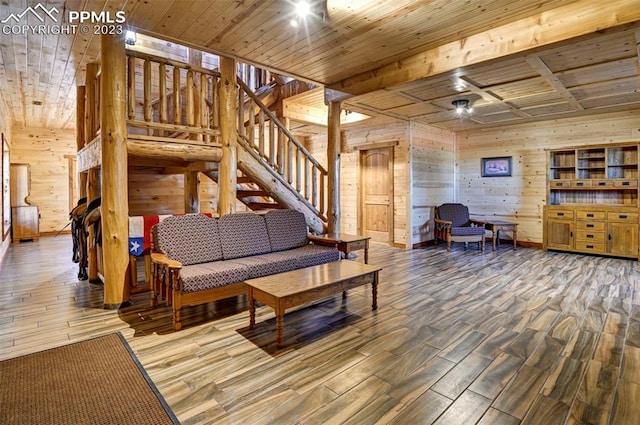 living room with wooden walls, wooden ceiling, and hardwood / wood-style floors