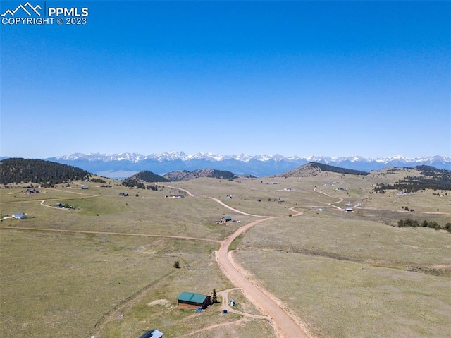 bird's eye view with a mountain view and a rural view