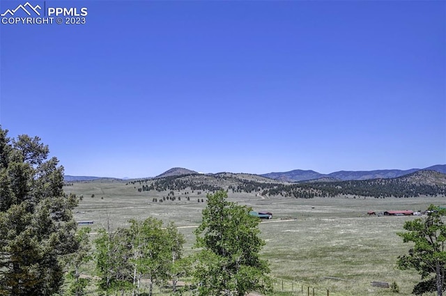 property view of mountains featuring a rural view