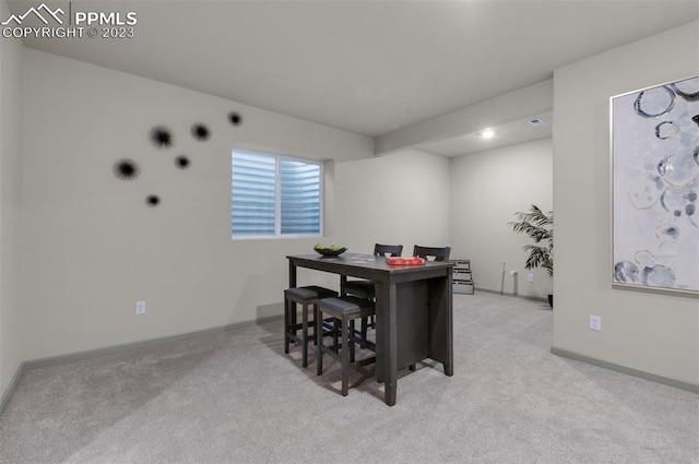 dining room featuring light colored carpet