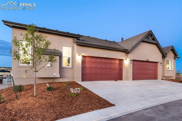 view of front of property featuring a garage