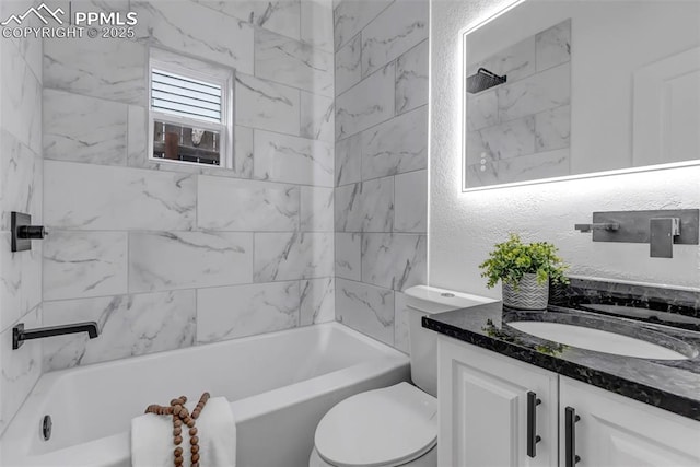 full bathroom featuring toilet, vanity, and tiled shower / bath