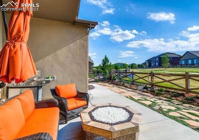 view of patio / terrace featuring a fire pit