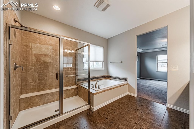 bathroom featuring separate shower and tub, ornamental molding, and tile patterned floors