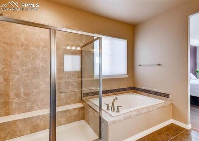 bathroom featuring shower with separate bathtub and tile patterned floors