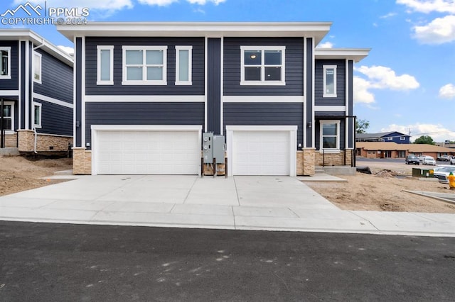 view of front of property with a garage