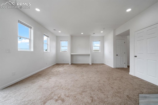 empty room featuring light carpet