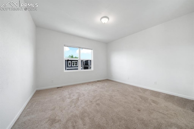 unfurnished room with carpet floors