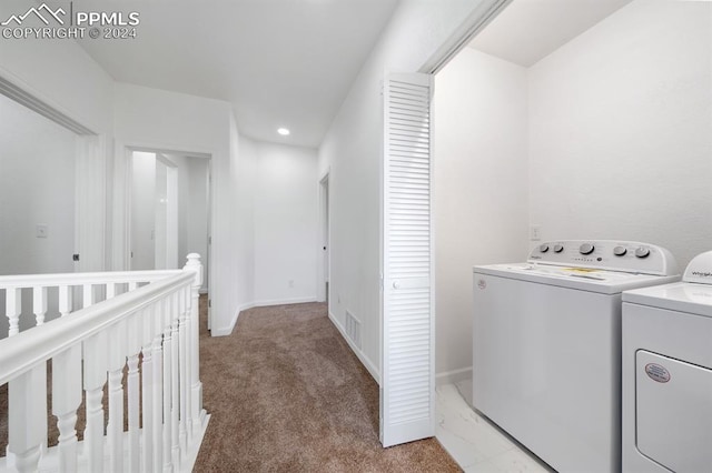 laundry area with carpet flooring and separate washer and dryer