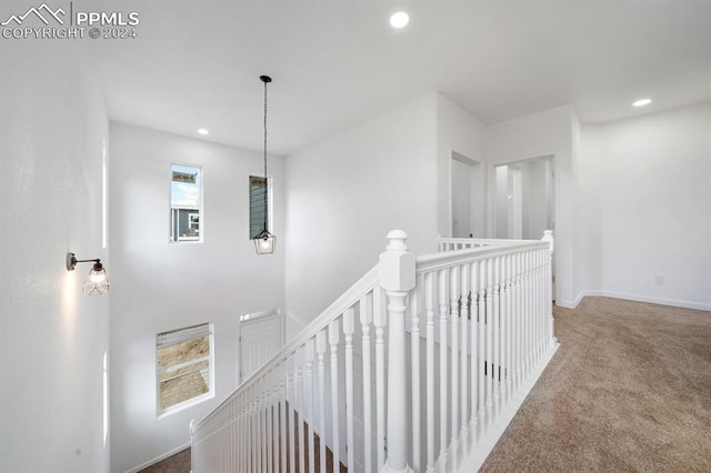 hallway with carpet flooring