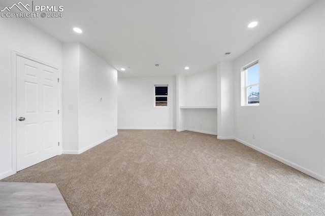 empty room with light colored carpet